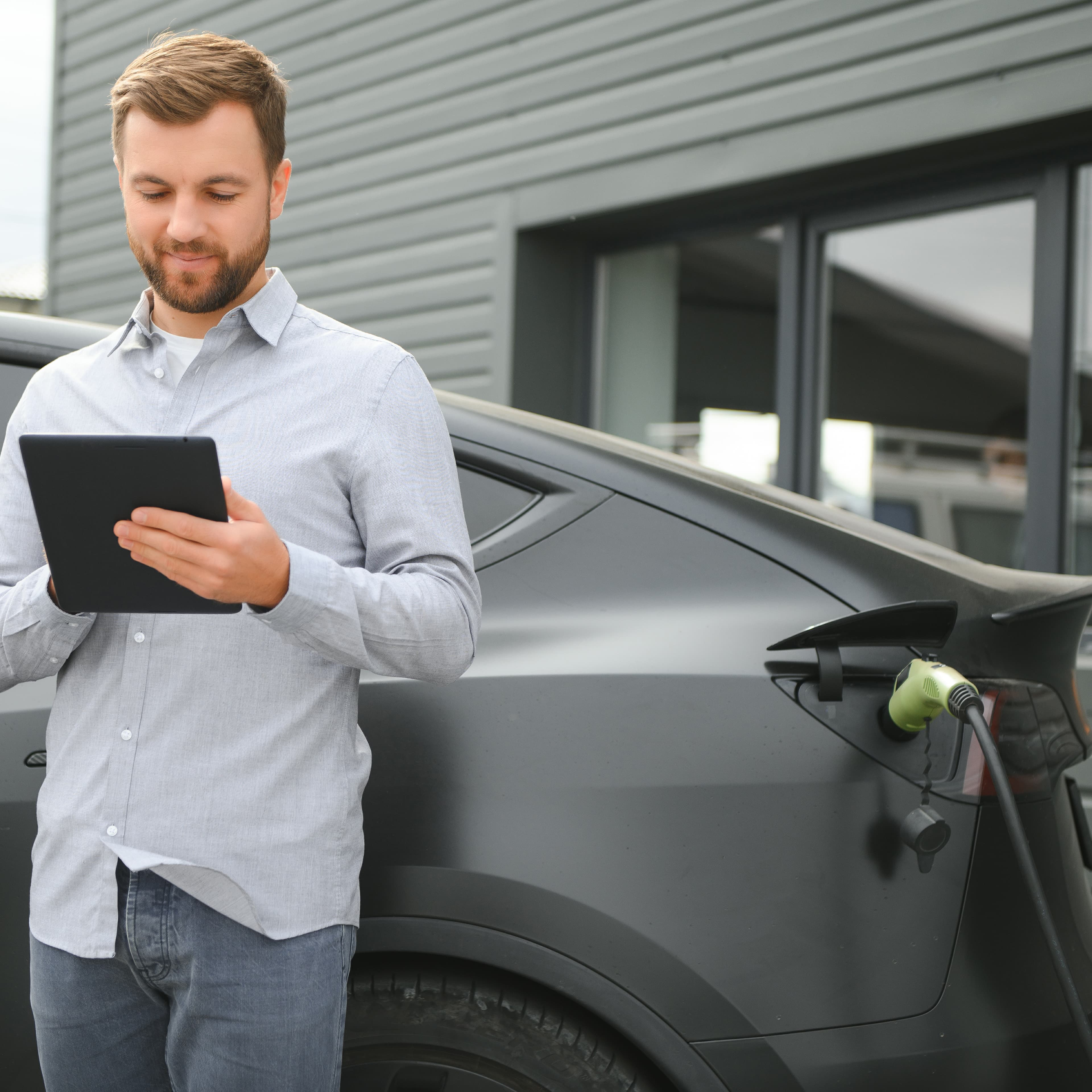 man-charging-electric-car-by-the-house-2025-03-13-22-05-49-utc1-1 man-charging-electric-car-by-the-house-2025-03-13-22-05-49-utc1-1