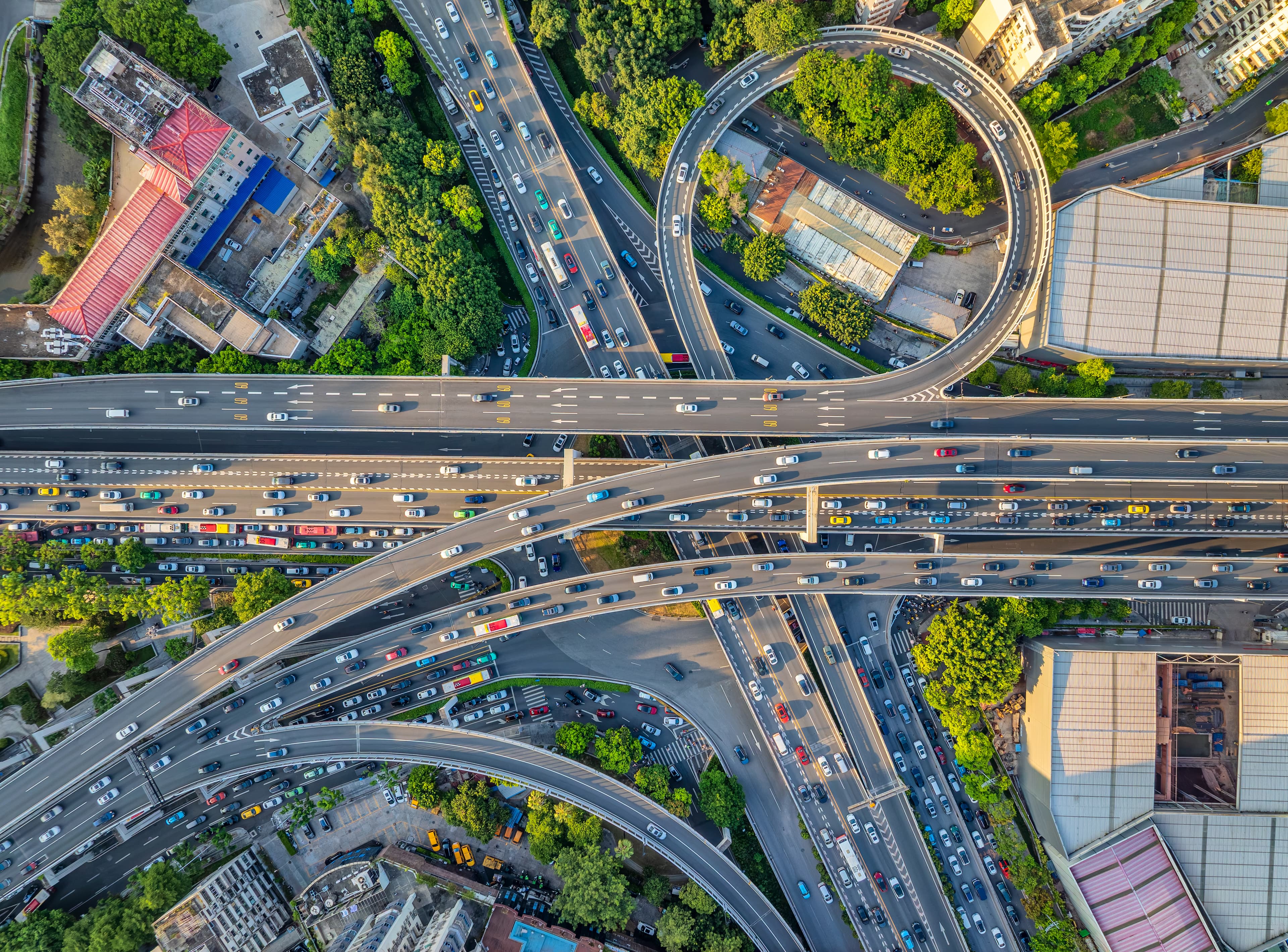 Aerial view of a busy multi-level highway interchange with heavy traffic. Aerial view of a busy multi-level highway interchange with heavy traffic.
