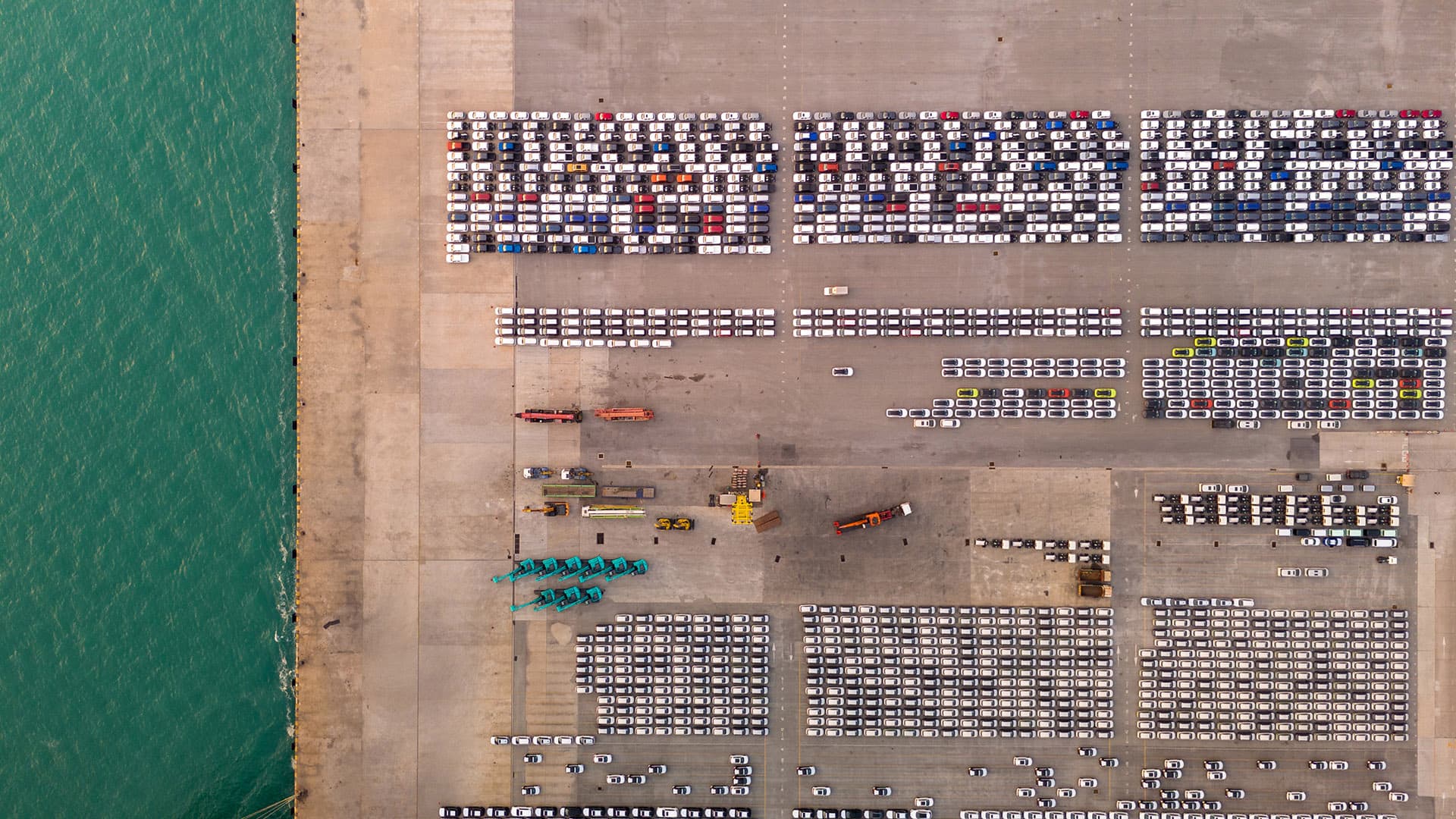 new-cars-parking-lot-shipping-dealer-aerial-view new-cars-parking-lot-shipping-dealer-aerial-view