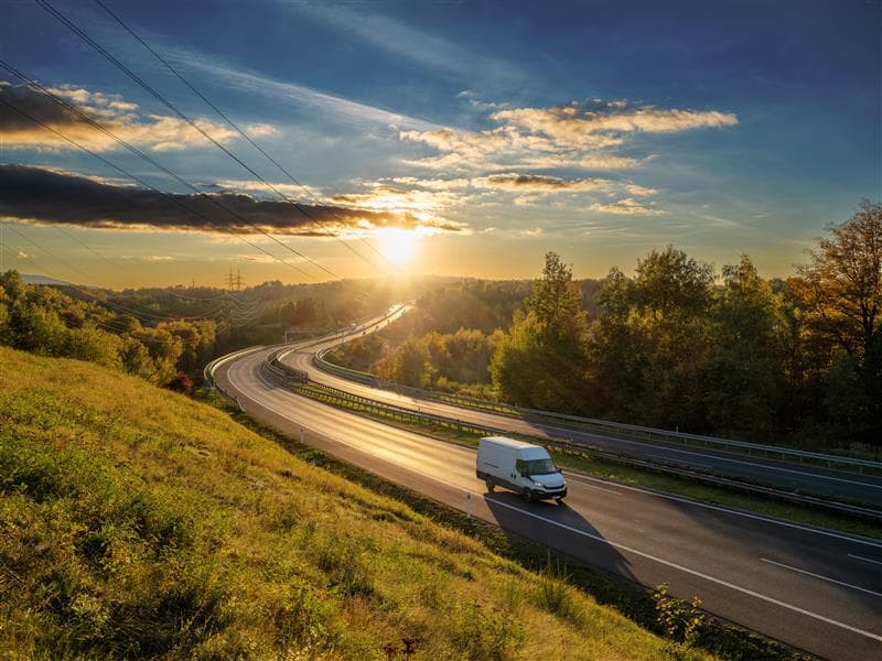 A fleet van driving down the highway. A fleet van driving down the highway.