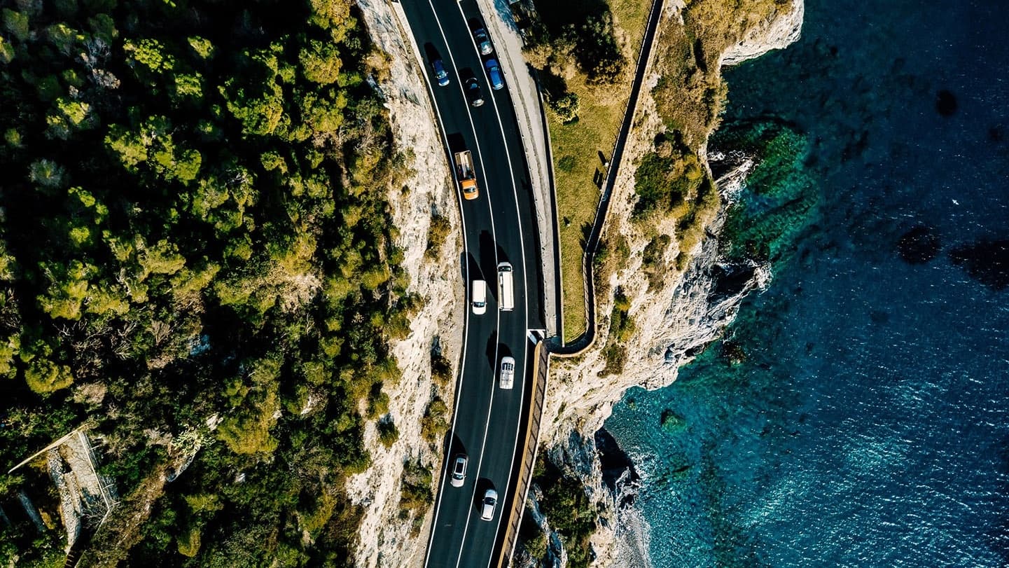 aerial-view-of-road-going-along-the-mountain aerial-view-of-road-going-along-the-mountain