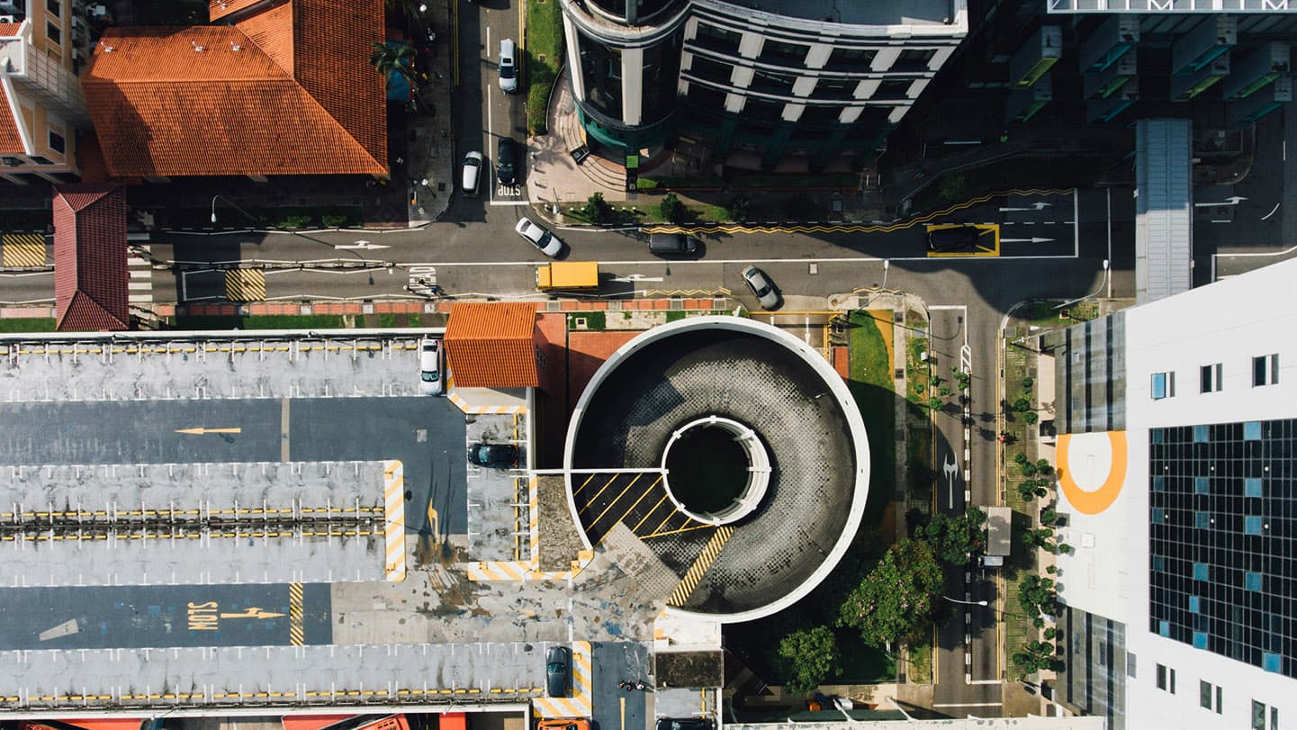 modern-city-aerial-view-parking-lot-spiral-ramps modern-city-aerial-view-parking-lot-spiral-ramps