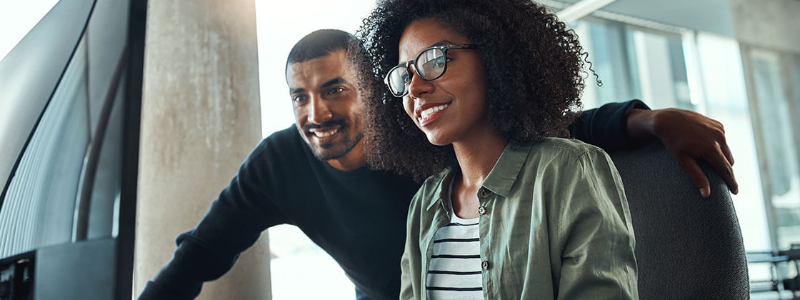 Man and woman looking at computer screen