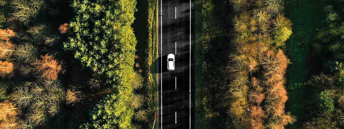 white car on road as seen from above