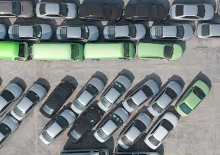 green and black parked cars