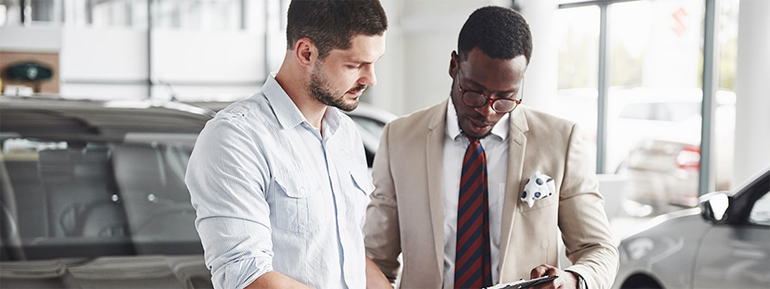 Two men discussing vehicle ordering