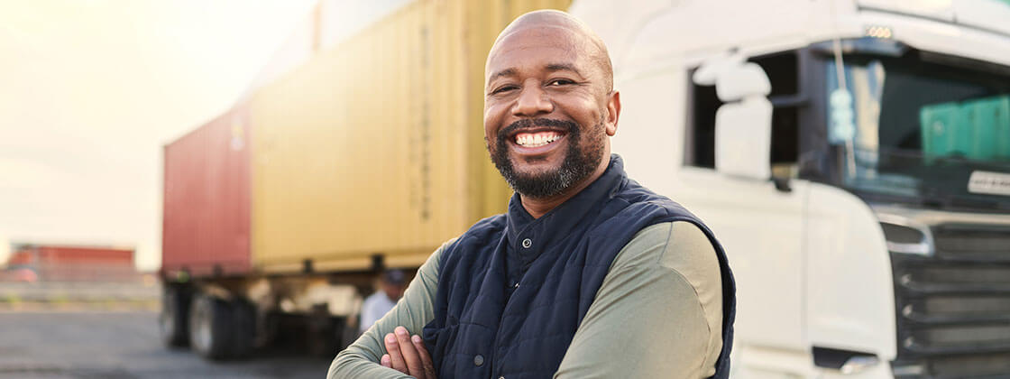 Man standing in front of white semi