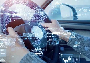 digital images over hands on a steering wheel