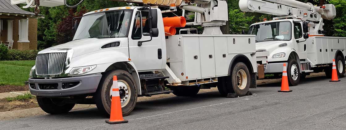 Two electrical service vehicles