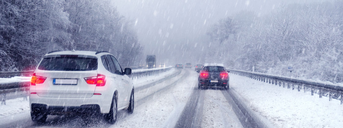Cars driving on wintery road