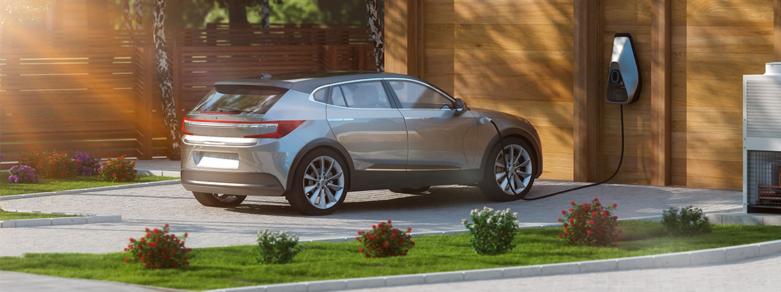 Electric car in home driveway