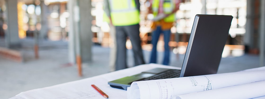 Construction workers in background