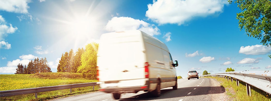 White delivery truck with blue sky