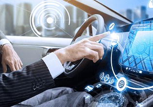 man in car with technology graphics