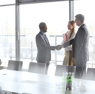 3 people meeting and shaking hands