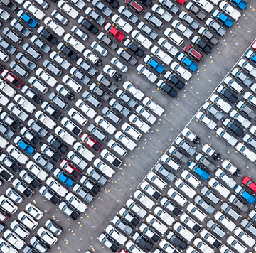 Aerial view of many vehicles in a parking lot