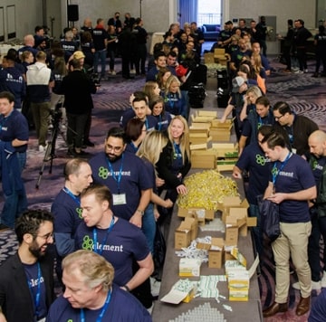 Element employees packing bags at a service event