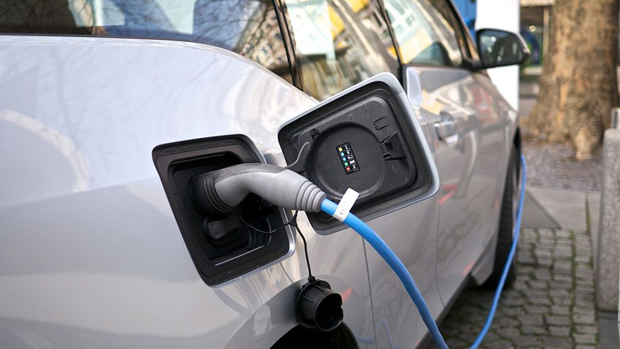 Electric vehicle being charged